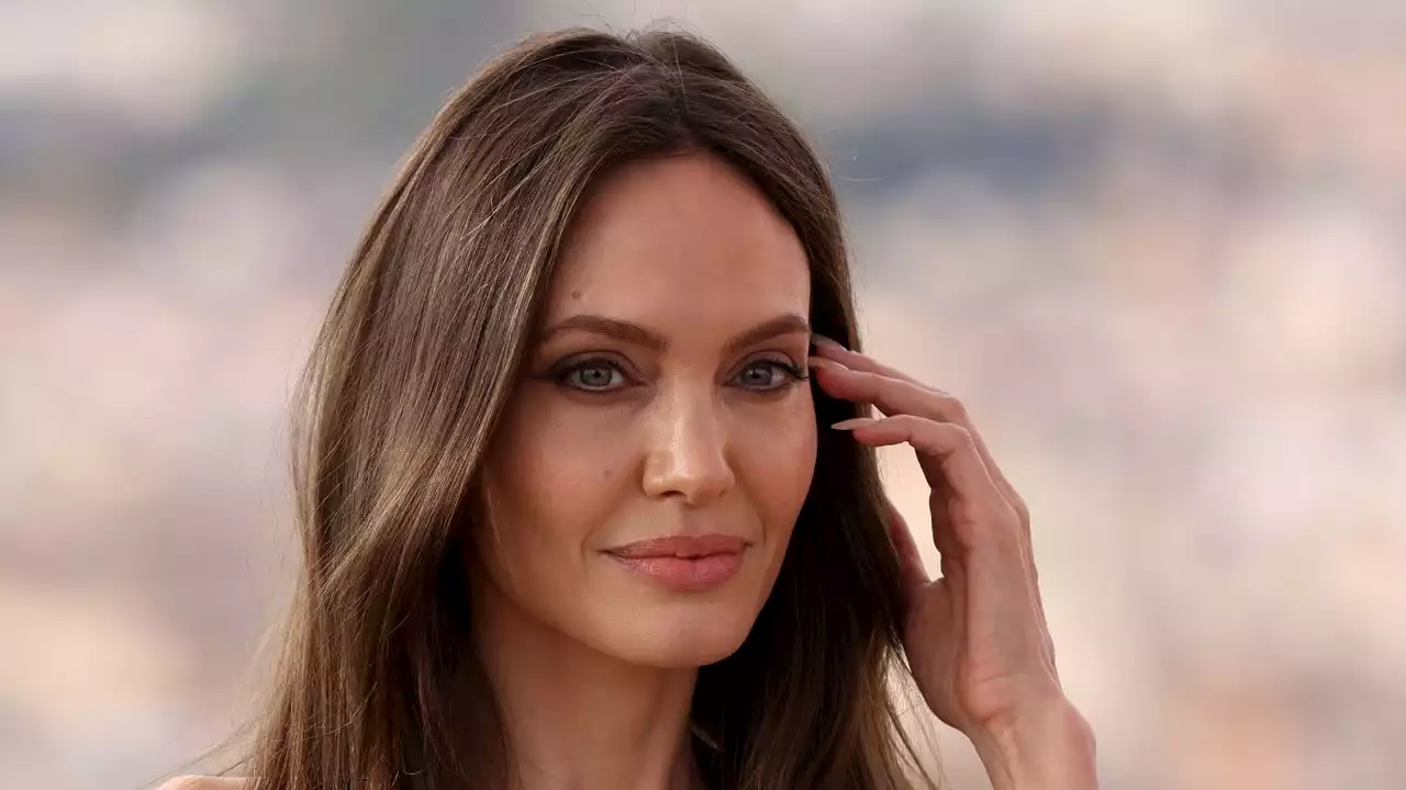 I Can’t Wait to Find Out What Angelina Jolie’s Mystery Finger Tattoos Say