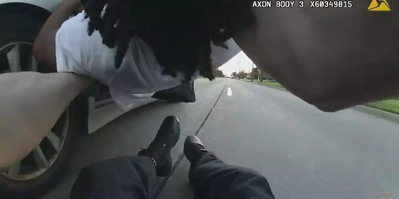 Bodycam video shows Cleveland officer dragged by getaway driver after foot chase