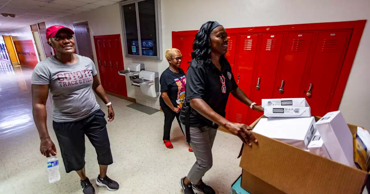 Former and current students of O.W. Holmes Academy walk through old campus one last time