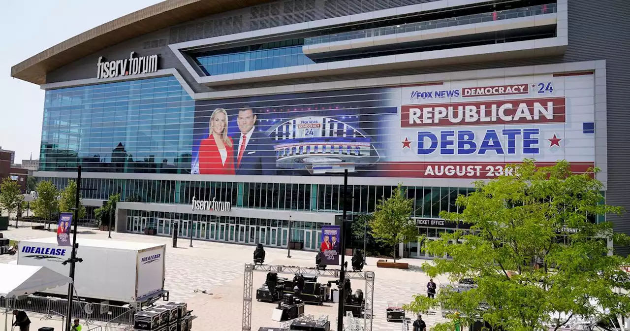 Who are the candidates at the GOP debate in Milwaukee, and what are their backgrounds?