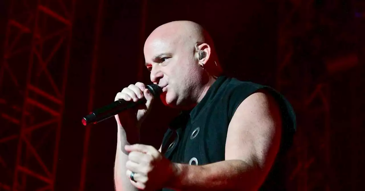 Heavy metal band Disturbed stop concert for little girl crying in the crowd