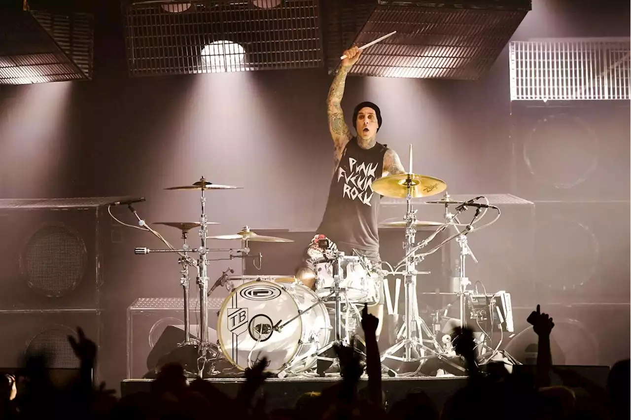 Travis Barker plays drums with blind 9-year-old fan at lemonade stand