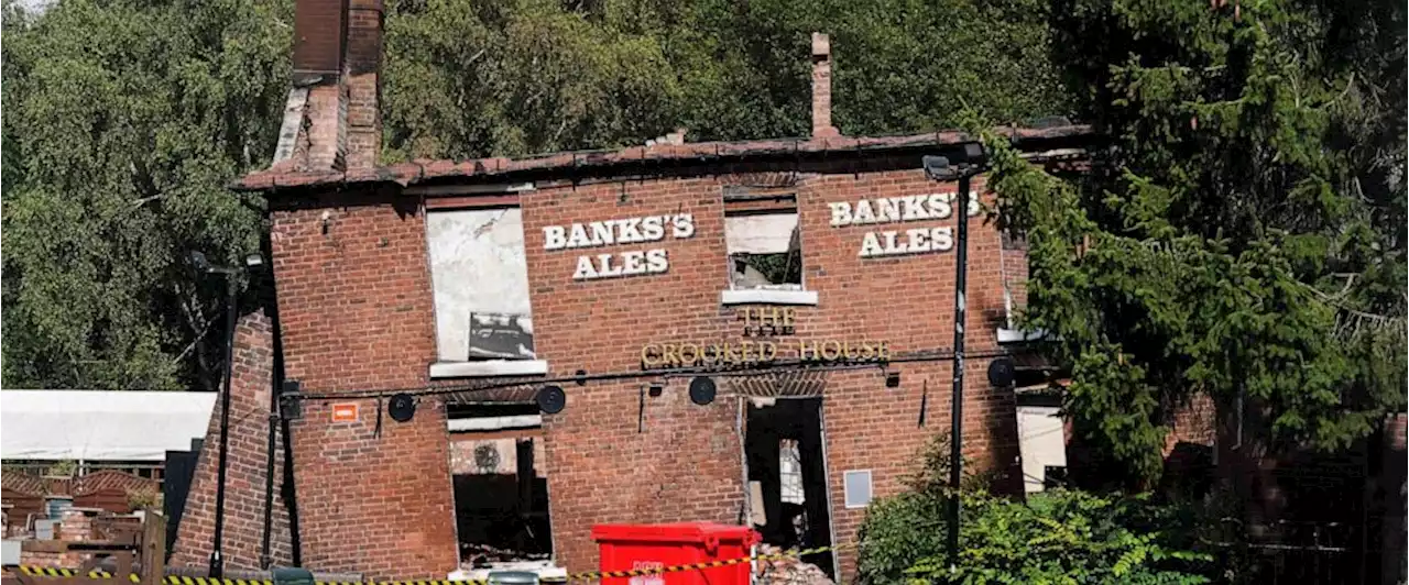 Police arrest two men in suspected torching of British pub cherished for its lopsided walls