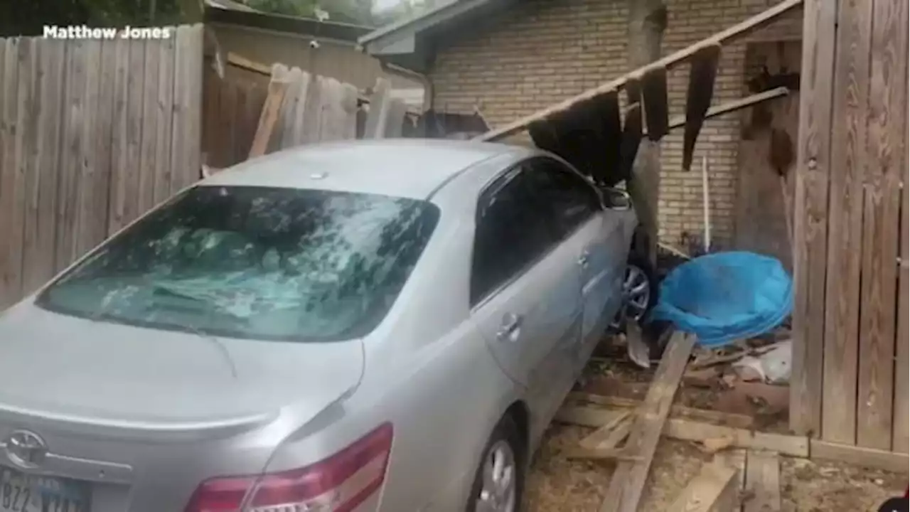 Stolen car hits pickup, crashes through fence of Northeast Side home