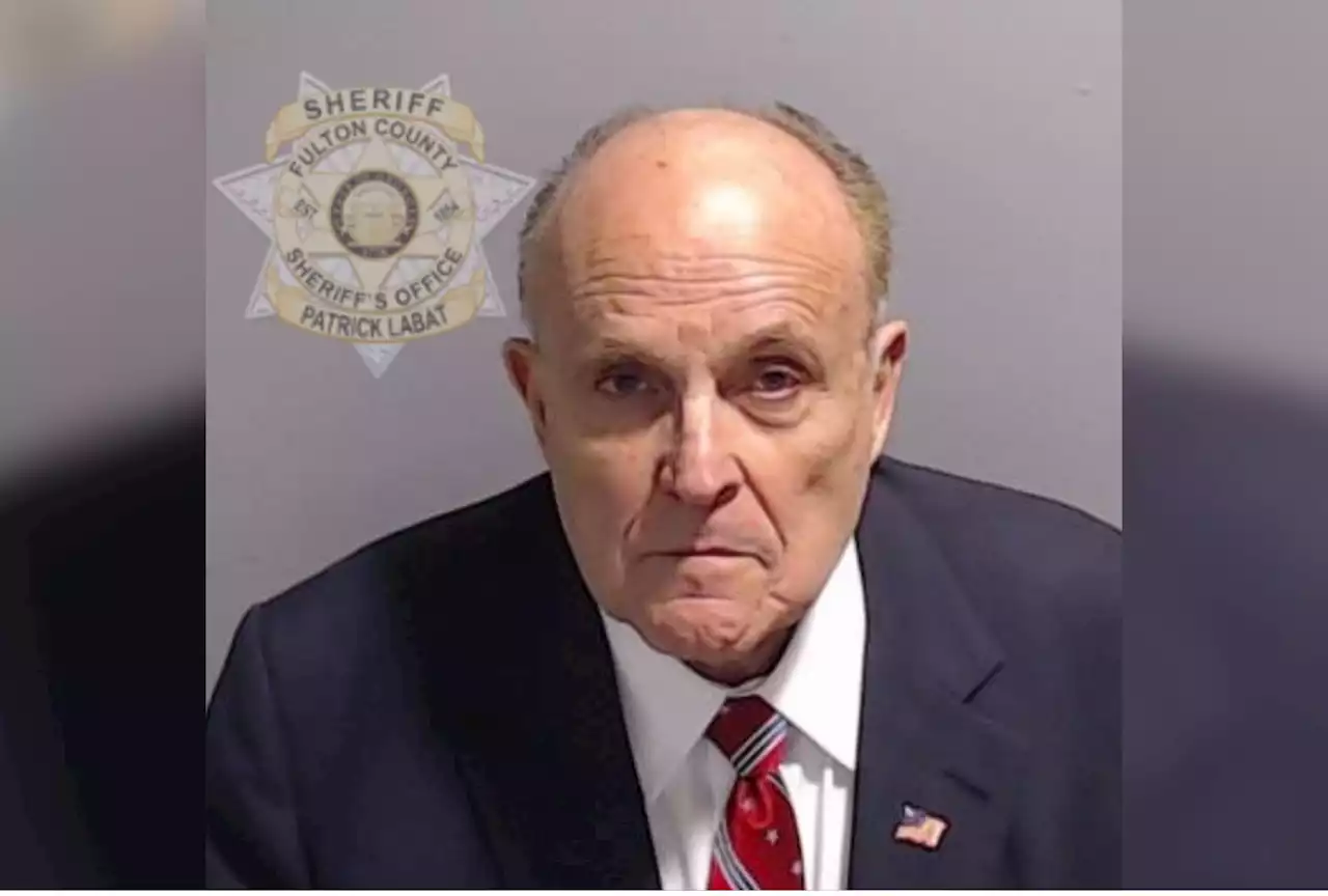 Rudy Giuliani mugshot released as Trump ally embraces arrest