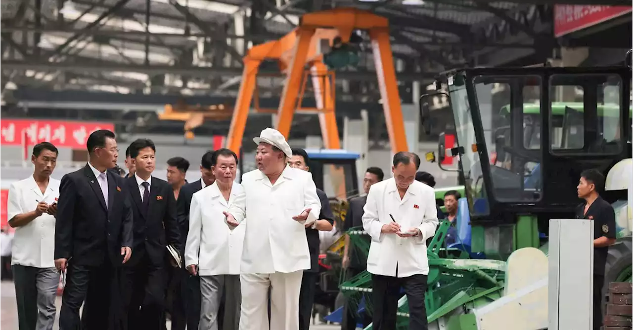 North Korea's Kim visits tractor factory amid food crisis