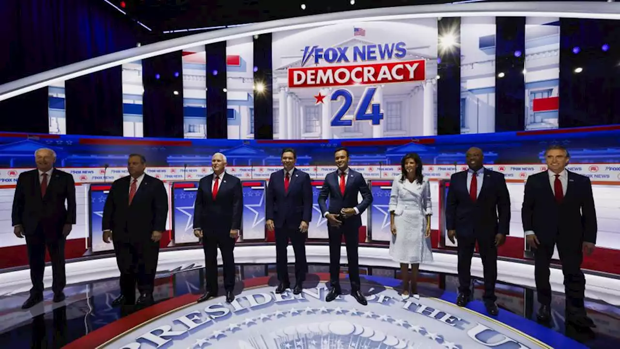 Despite his absence, Trump steals show as first Republican debate kicks off