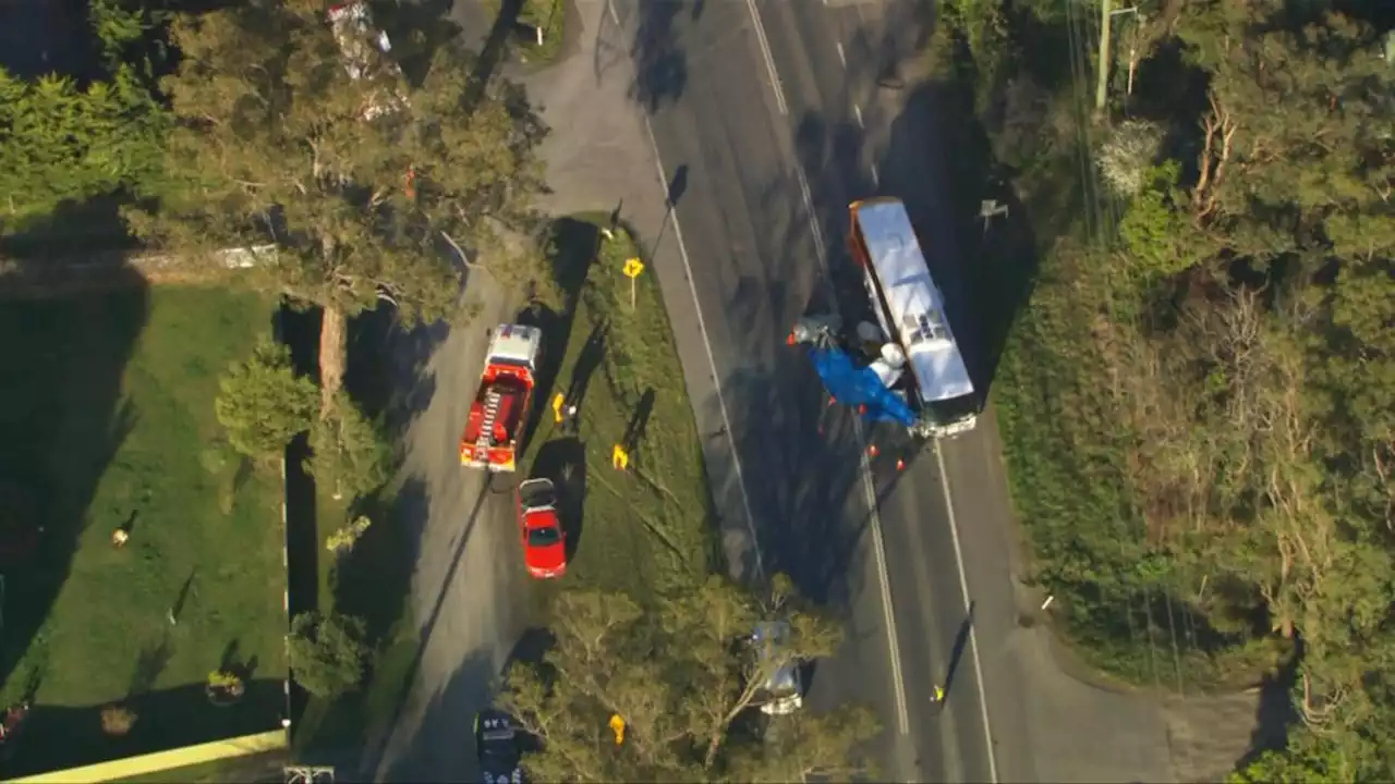 One dead, highway closed as school bus collides with van in Victoria