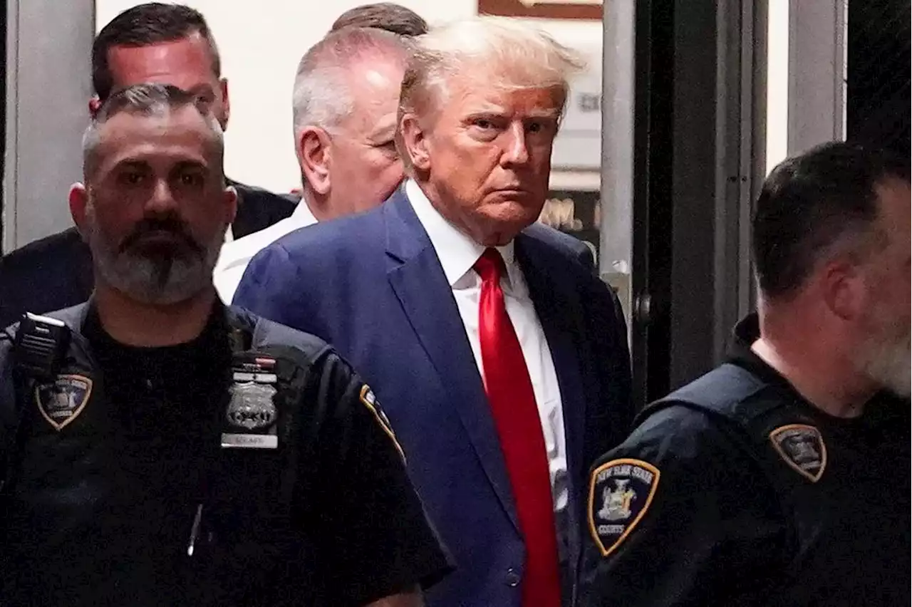 Trump surrenders at Atlanta jail on election charges, then is quickly released on $200,000 bond