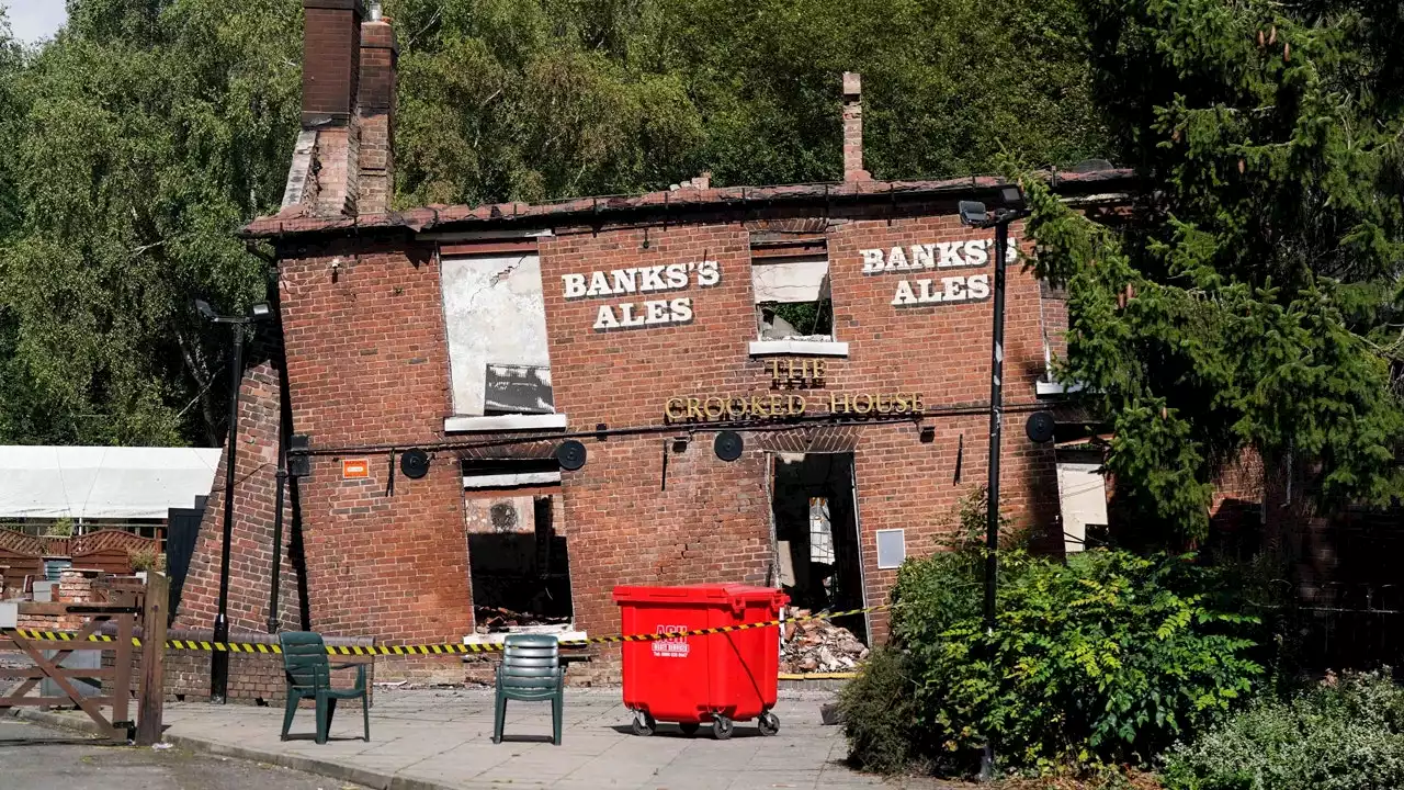 2 men arrested, accused of arson attack on England's 'Crooked House' pub