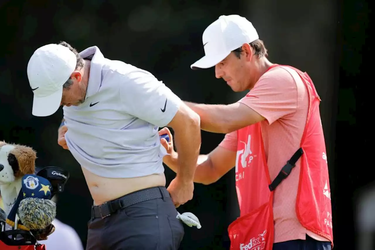 Rory McIlroy three behind lead despite muscle spasms leading into tournament