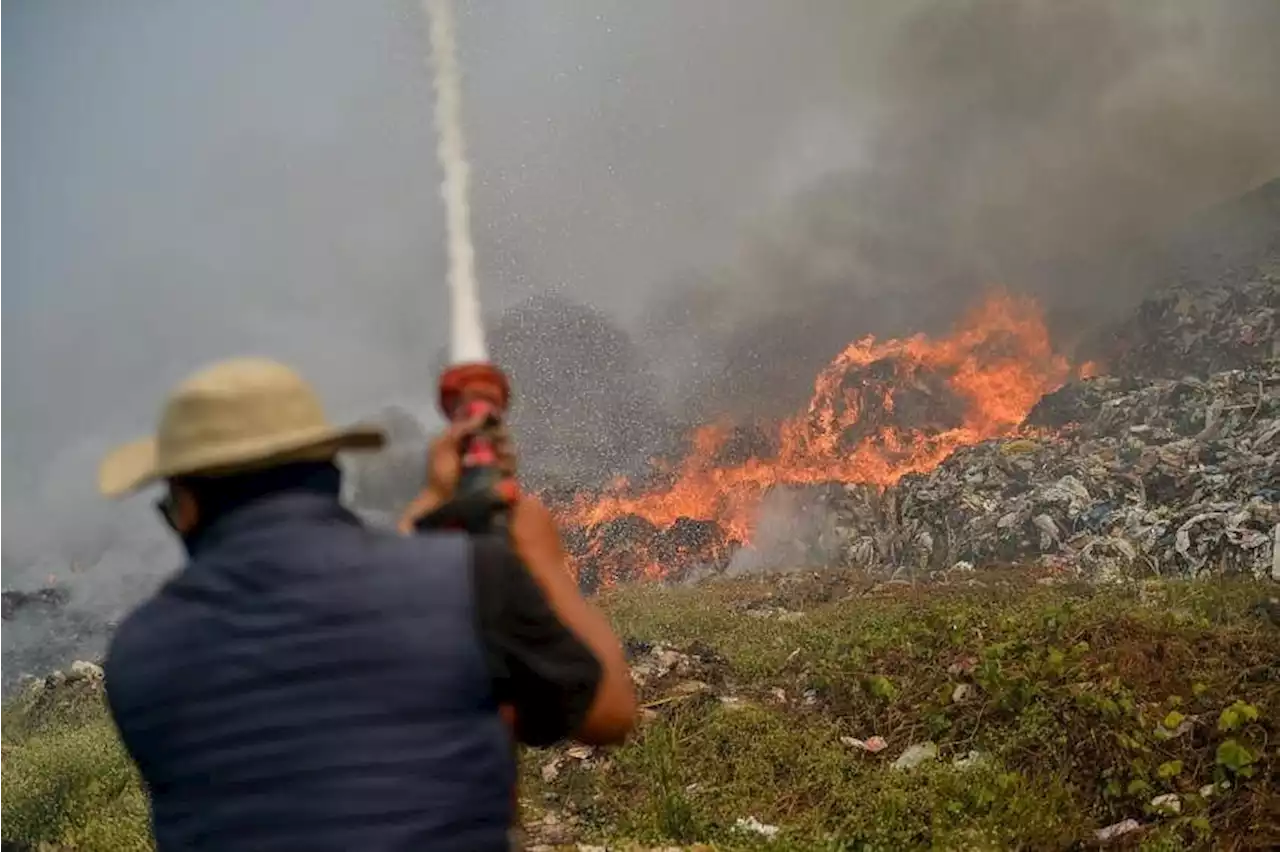 Rubbish fire declared an emergency as thick smoke chokes locals in Indonesia's West Java province