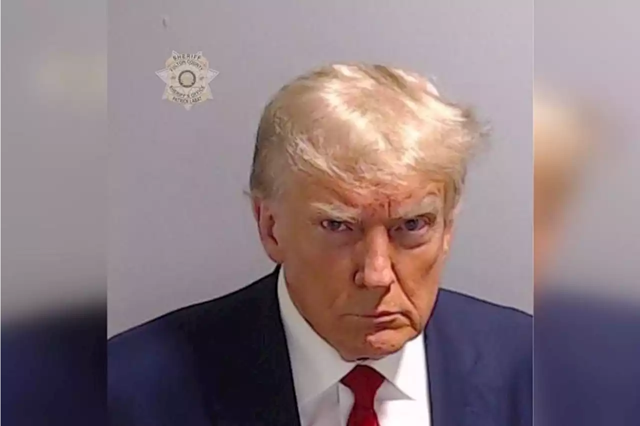 Trump’s mug shot released after booking at Atlanta jail over election charges