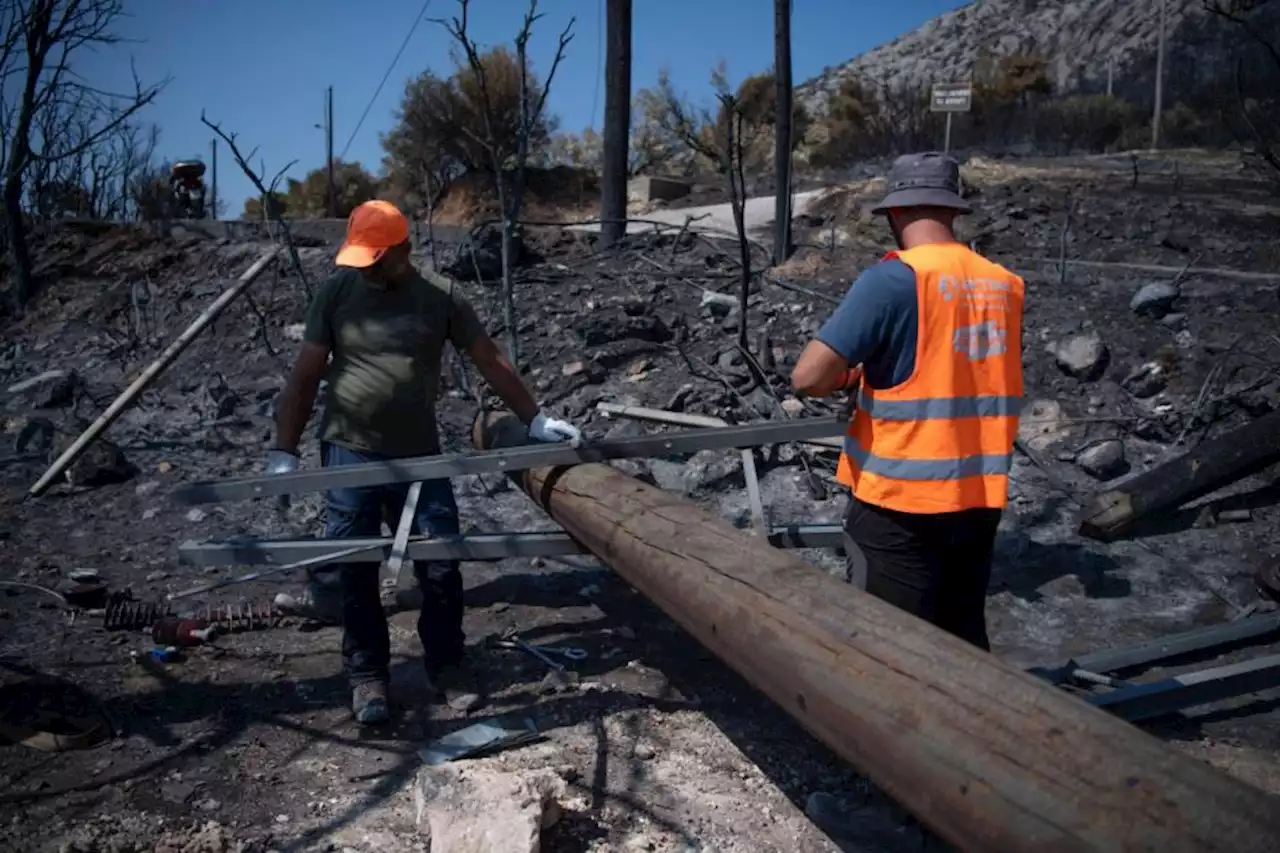 Greek fire officials arrest two for arson as wildfires continue to burn