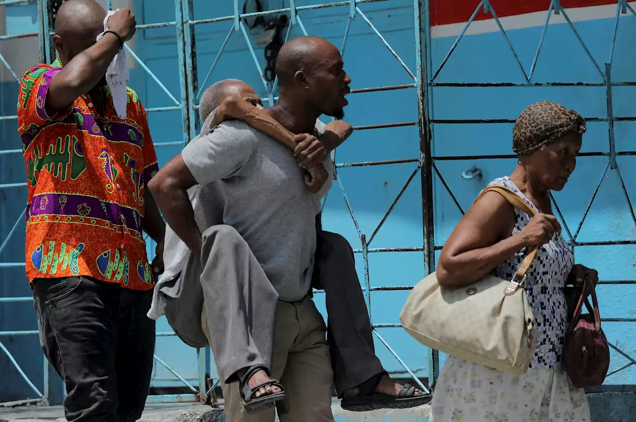 Haitians shelter in sports center as fresh attacks displace nearly 9,000