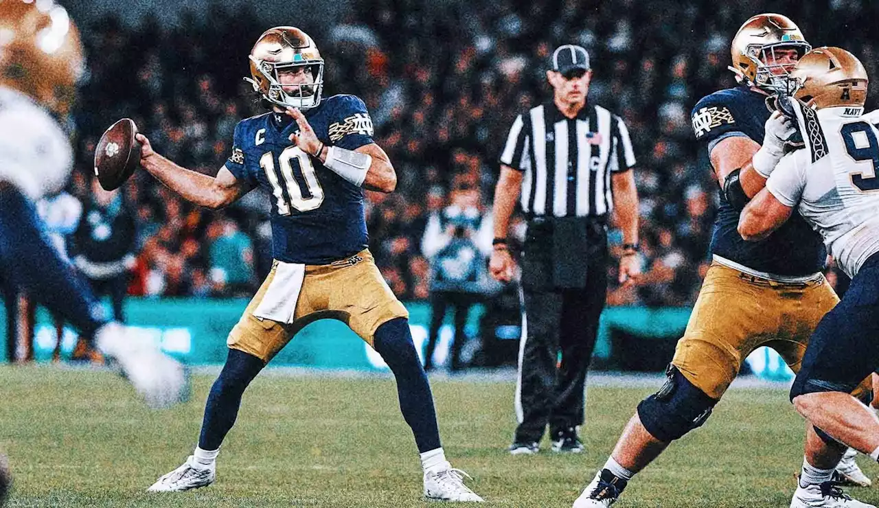 Hartman throws four TDs in No. 13 Notre Dame's 42-3 win over Navy in Dublin