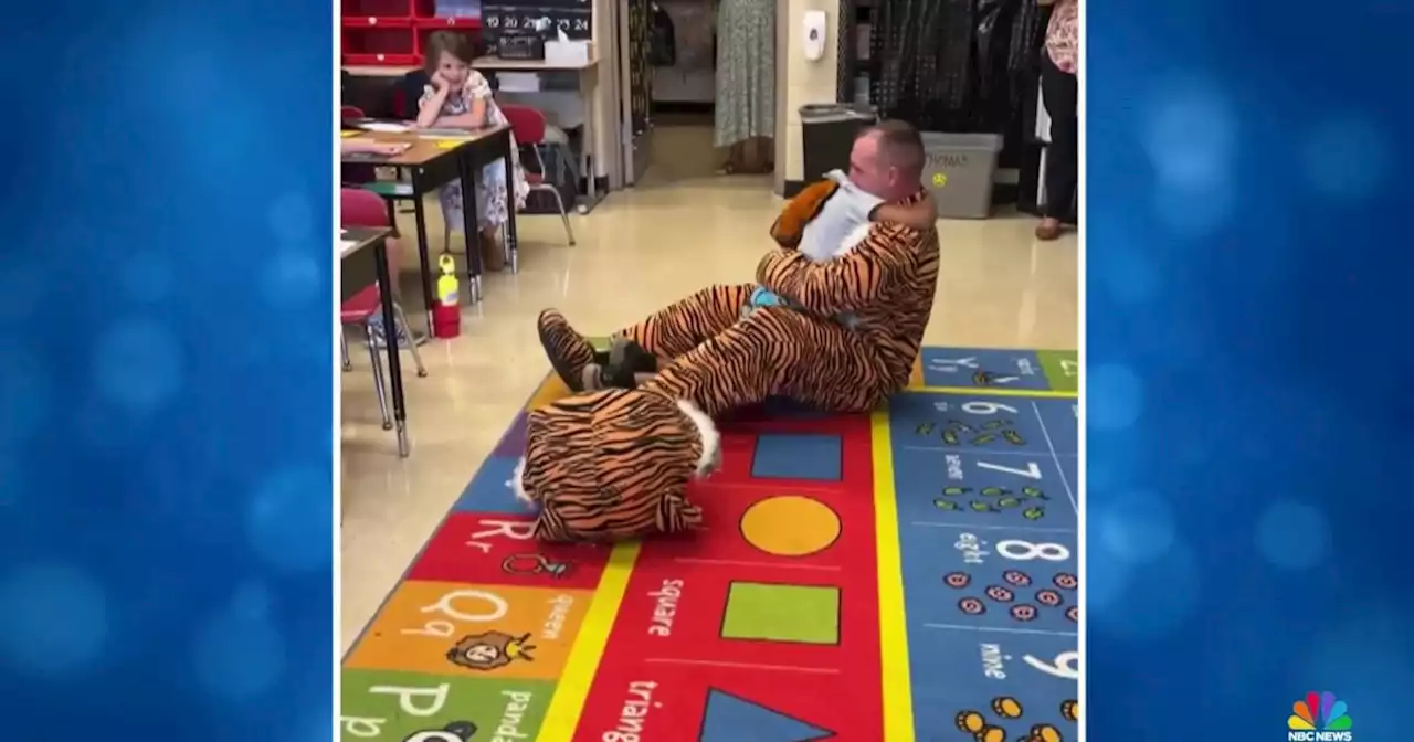 Soldier dresses up as elementary school mascot and surprises son on first day