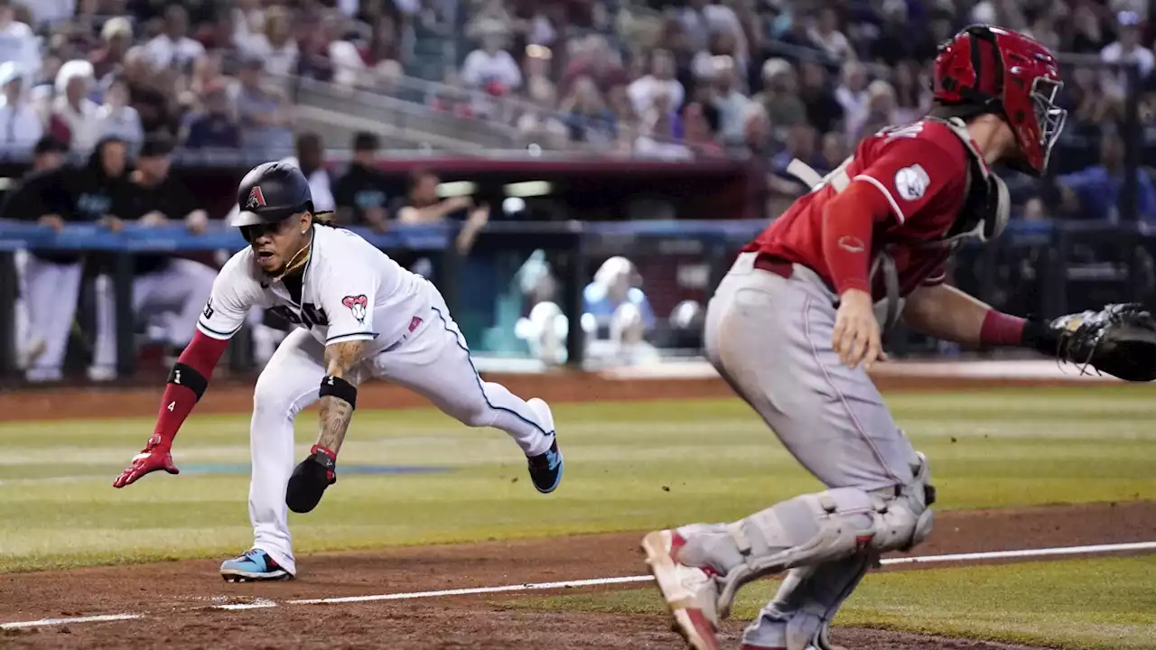 Walker's sacrifice fly in the 8th inning leads Diamondbacks to a 5-2 win over the Reds