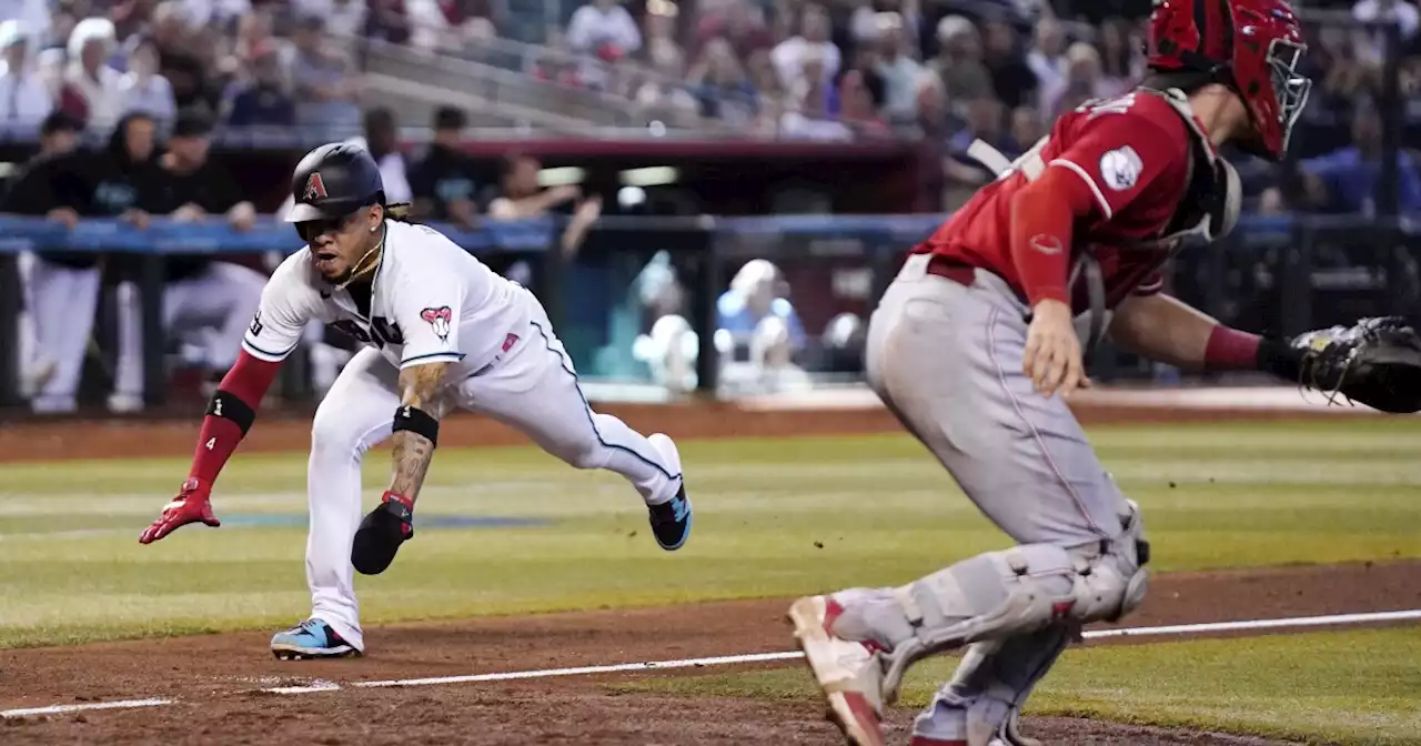 Walker's sacrifice fly in 8th inning leads Diamondbacks to a 5-2 win over Reds