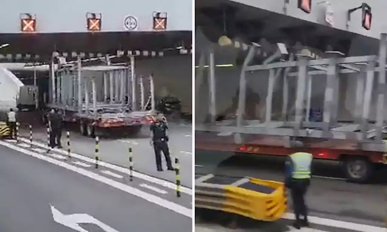 Driver arrested after trailer appears to breach height limit, hits barrier on MCE