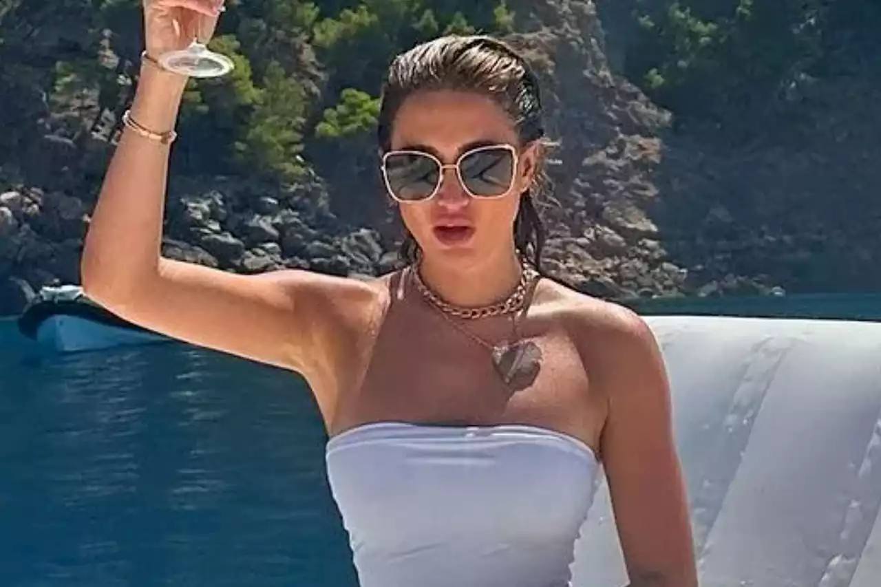 Georgia Harrison sends fans wild in white swimsuit after losing passport in Spain