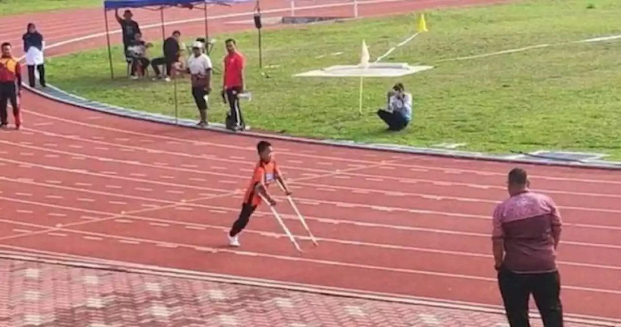 'I continued even though my trousers nearly fell off': Malaysian boy with one leg finishes last in 100m race but wins the Internet