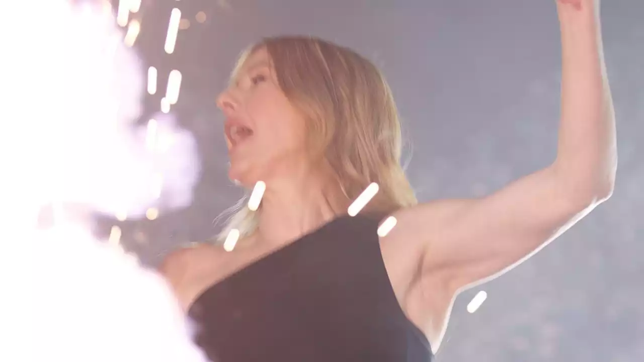 Ellie Goulding is hit by the pyro onstage at Victorious Festival