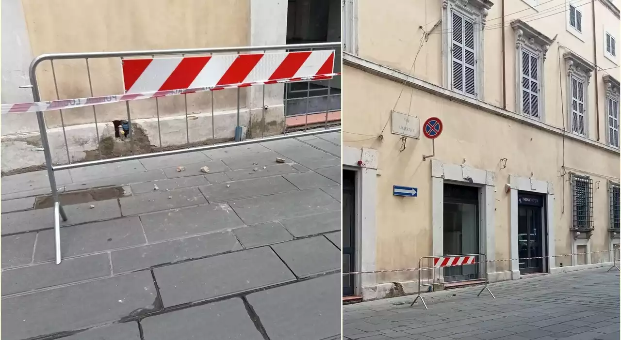 Foligno, per la pioggia cadono pezzi di cornicione in centro: donna salvata dall'ombrello