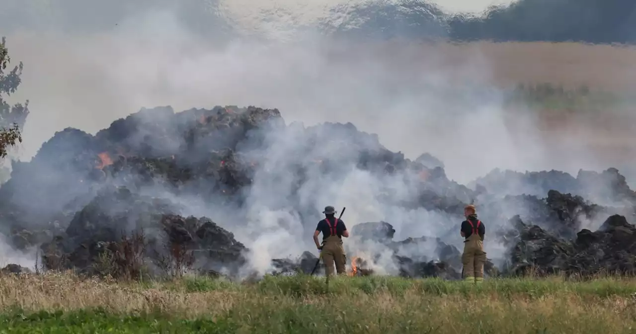 Scale of haybale fire that continues to burn in village