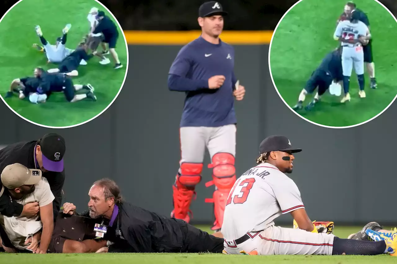 Braves’ Ronald Acuna Jr. knocked to ground while fans rush on field to hug him