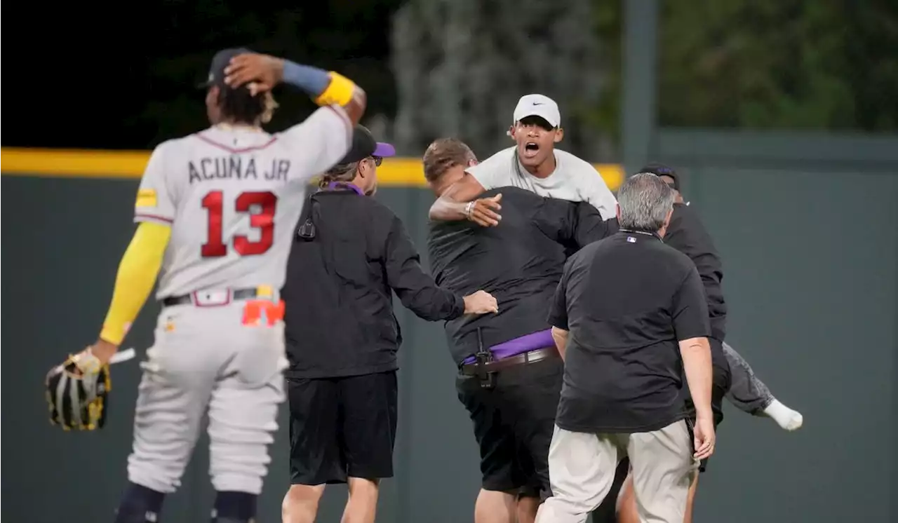 Atlanta’s Acuna braves 2 fans running onto field in Denver