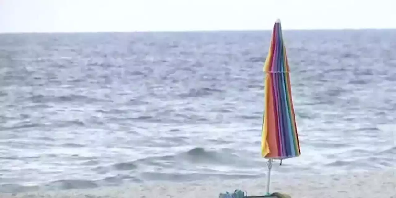 Flying beach umbrella impales woman’s leg