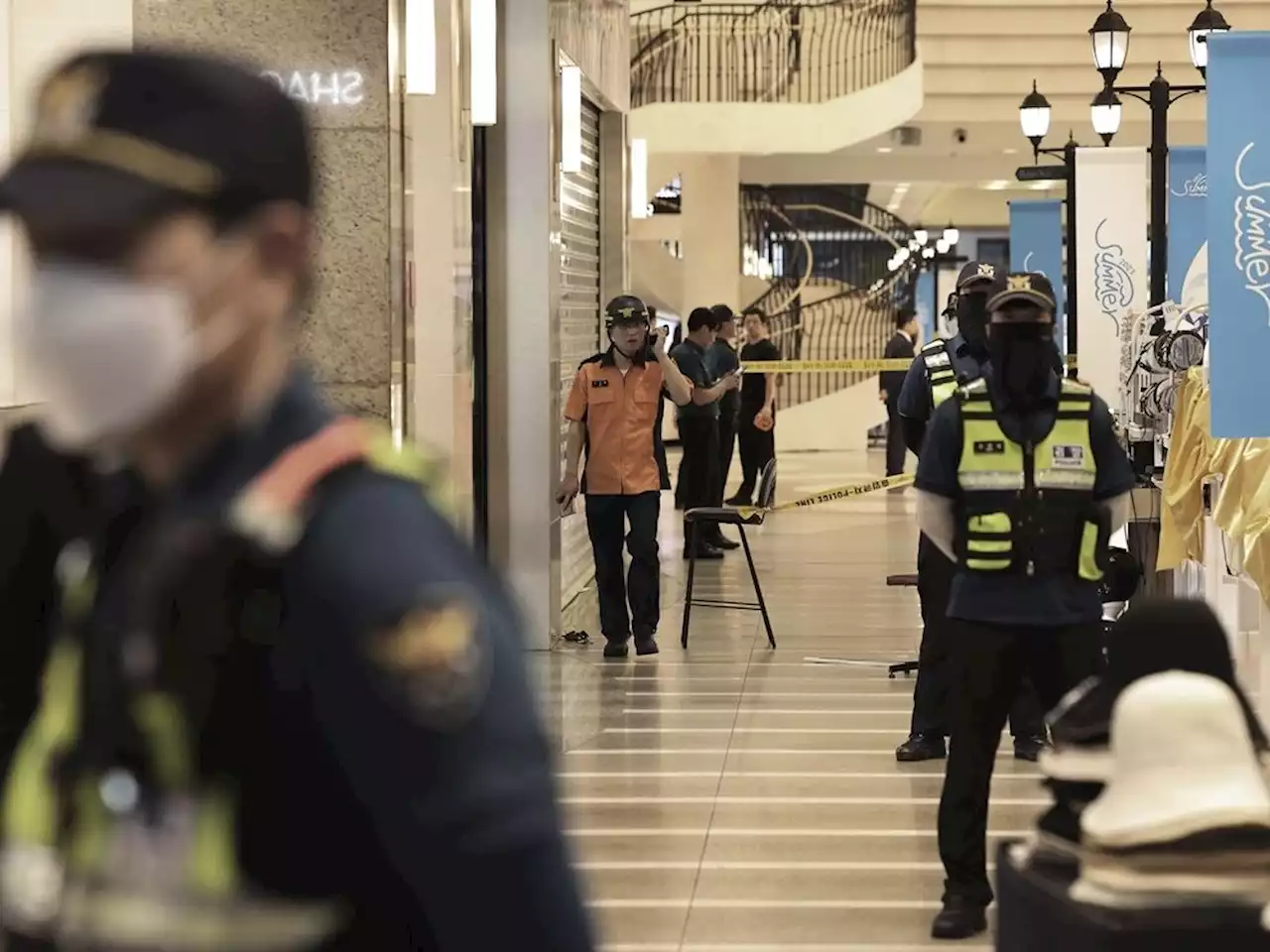 13 injured in South Korea when a man rams a car onto a sidewalk, stabs pedestrians