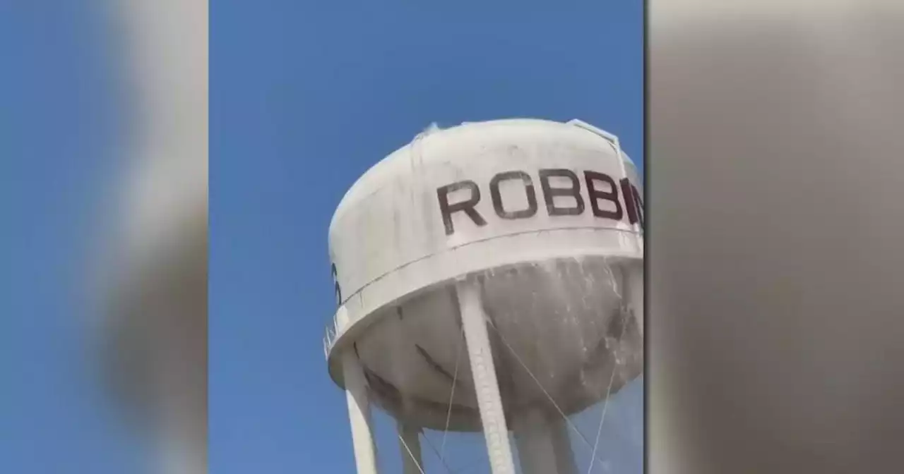 Why did thousands of gallons pour out of a Robbins water tower?