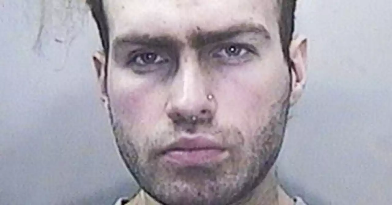 Chilling moment killer seen eating Haribo sweets after beheading stranger