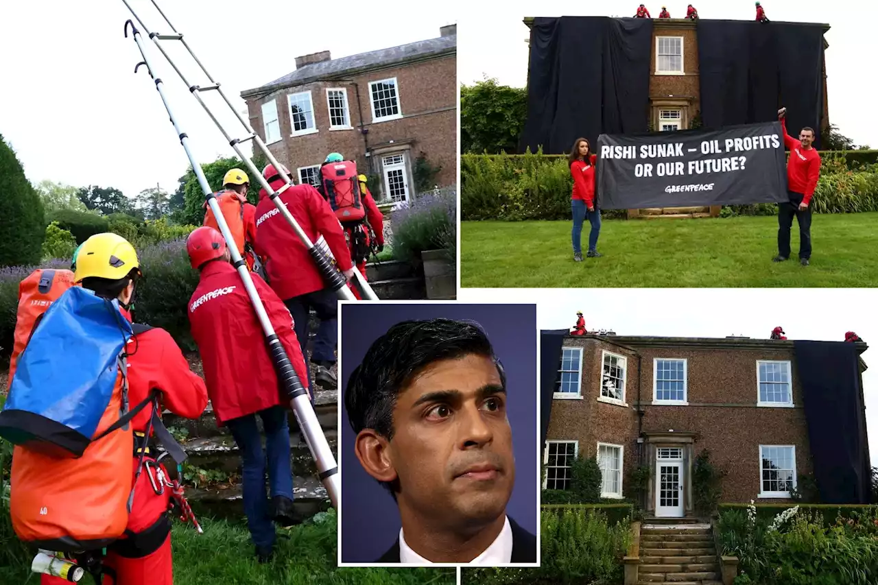 Greenpeace demonstrators drape UK prime minister’s house in black to protest oil expansion