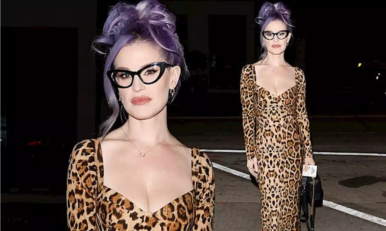 Kelly Osbourne showcases her svelte frame in a low-cut dress