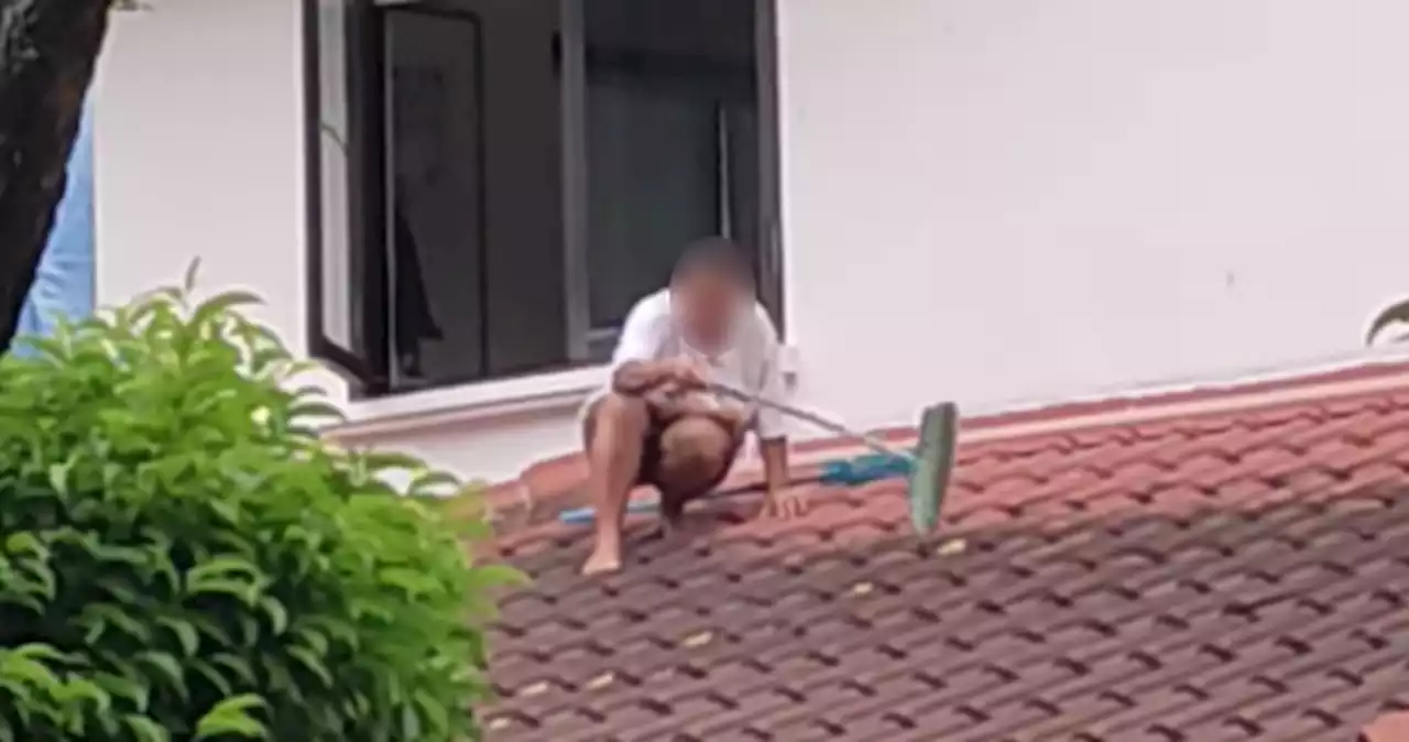 'So dangerous': Domestic helper seen cleaning roof on multi-storey property sparks alarm