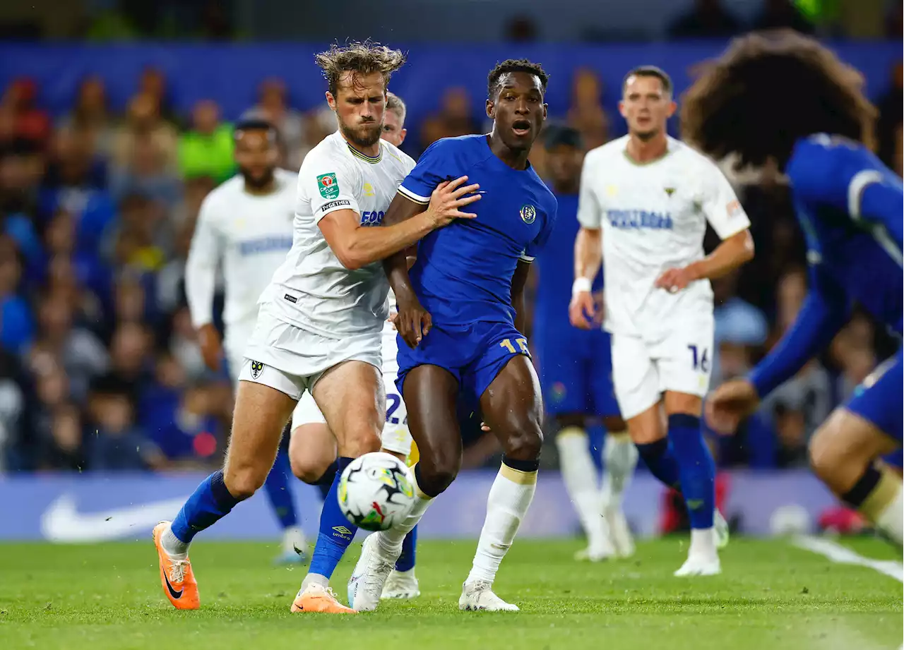 Soccer-Chelsea fight back to beat Wimbledon 2-1 in League Cup