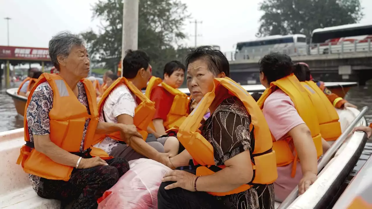 Deadly flooding in China worsens as rescues continue and areas downriver brace for high water