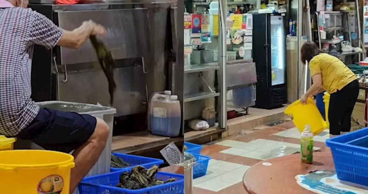 Hawker blasted for leaving vegetables on floor while next-door stall owner washes area