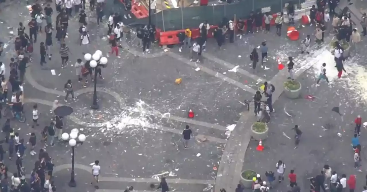 Large crowd gathered at Union Square seen hurling objects