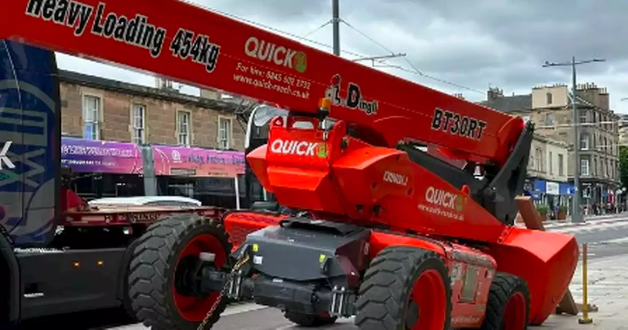 Cherry picker smashes through pavement of busy Scots street