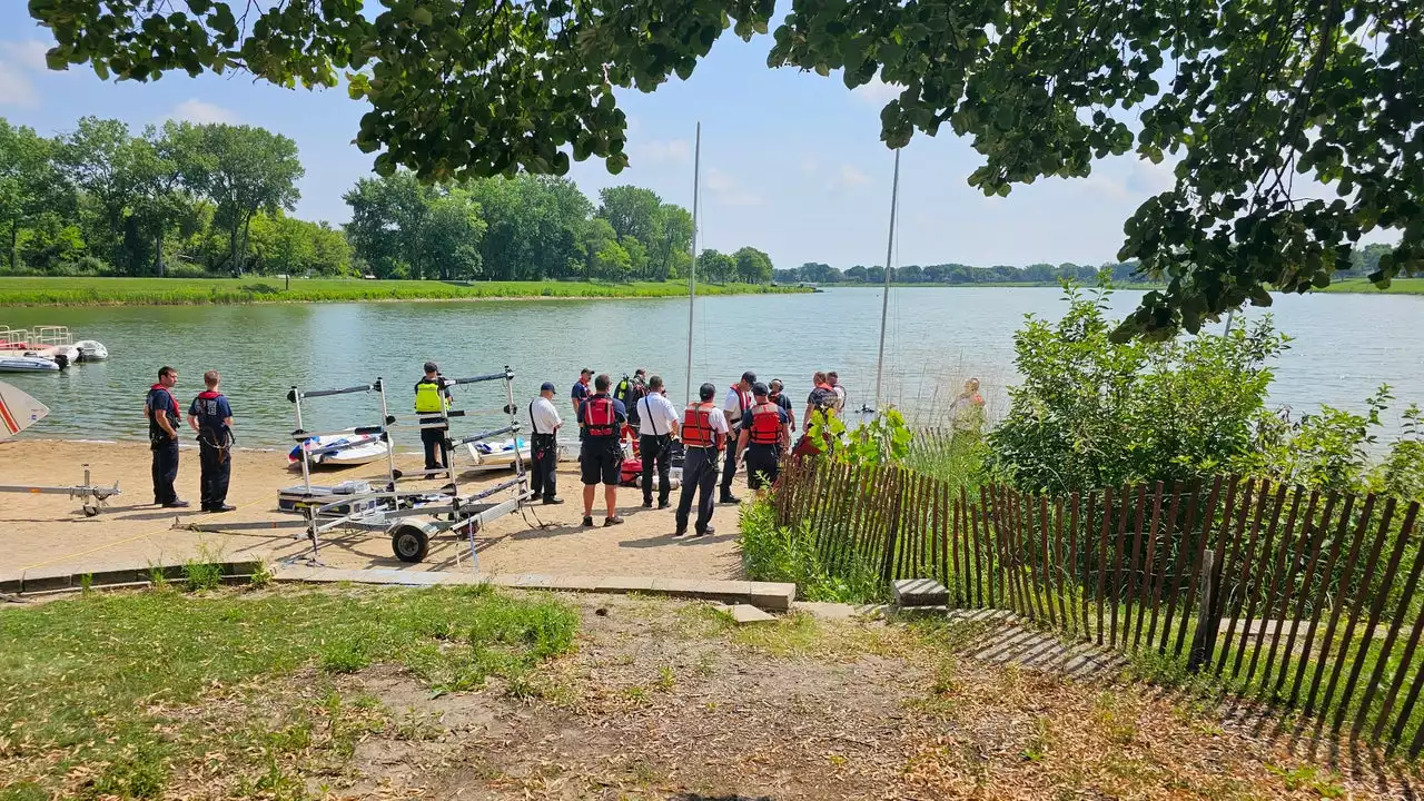 Death investigation underway after body pulled from suburban lake