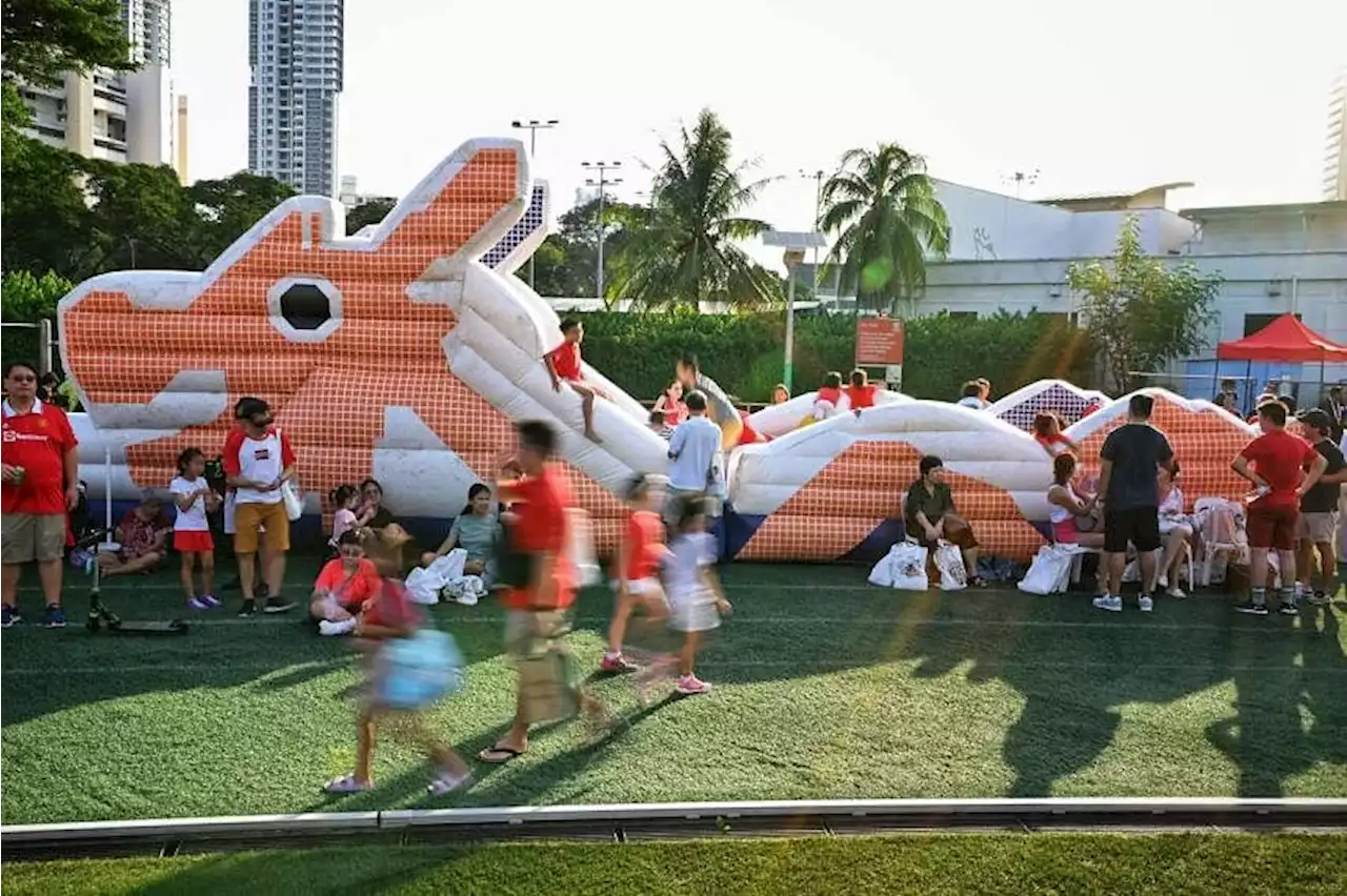 National Day celebrations kick off in the heartland with sports, kampung games and carnival snacks