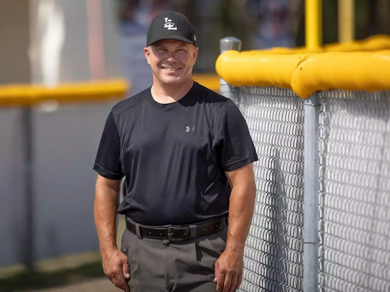 Volunteer umpires working together at Little League championship