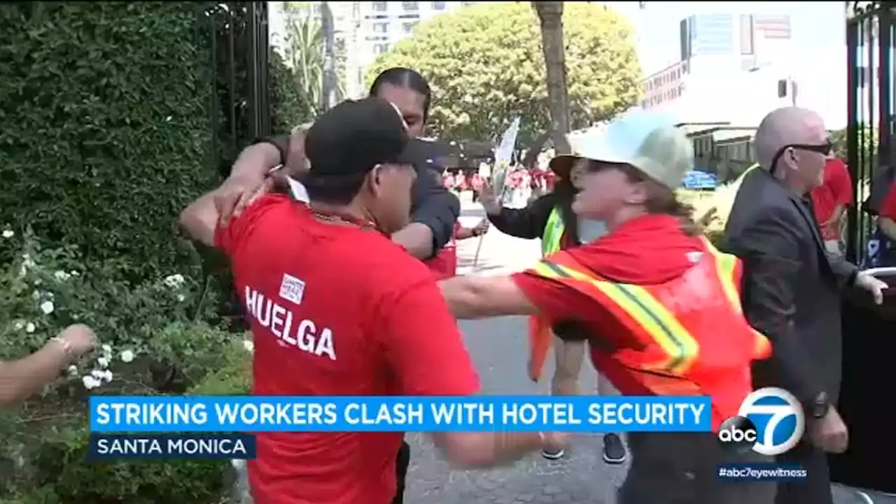 Striking hotel workers clash with security guards while picketing in Santa Monica