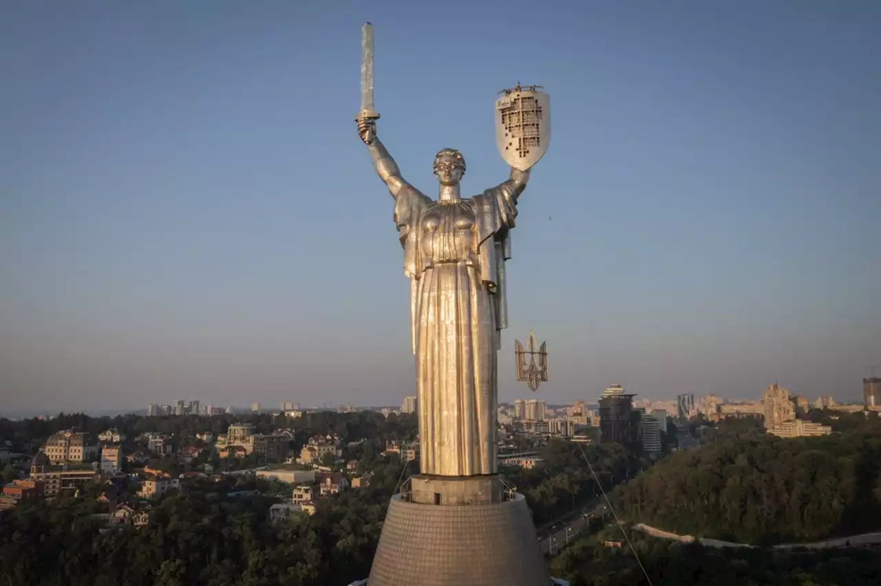 Ukraine replaces Soviet coat of arms with trident on towering Kyiv landmark