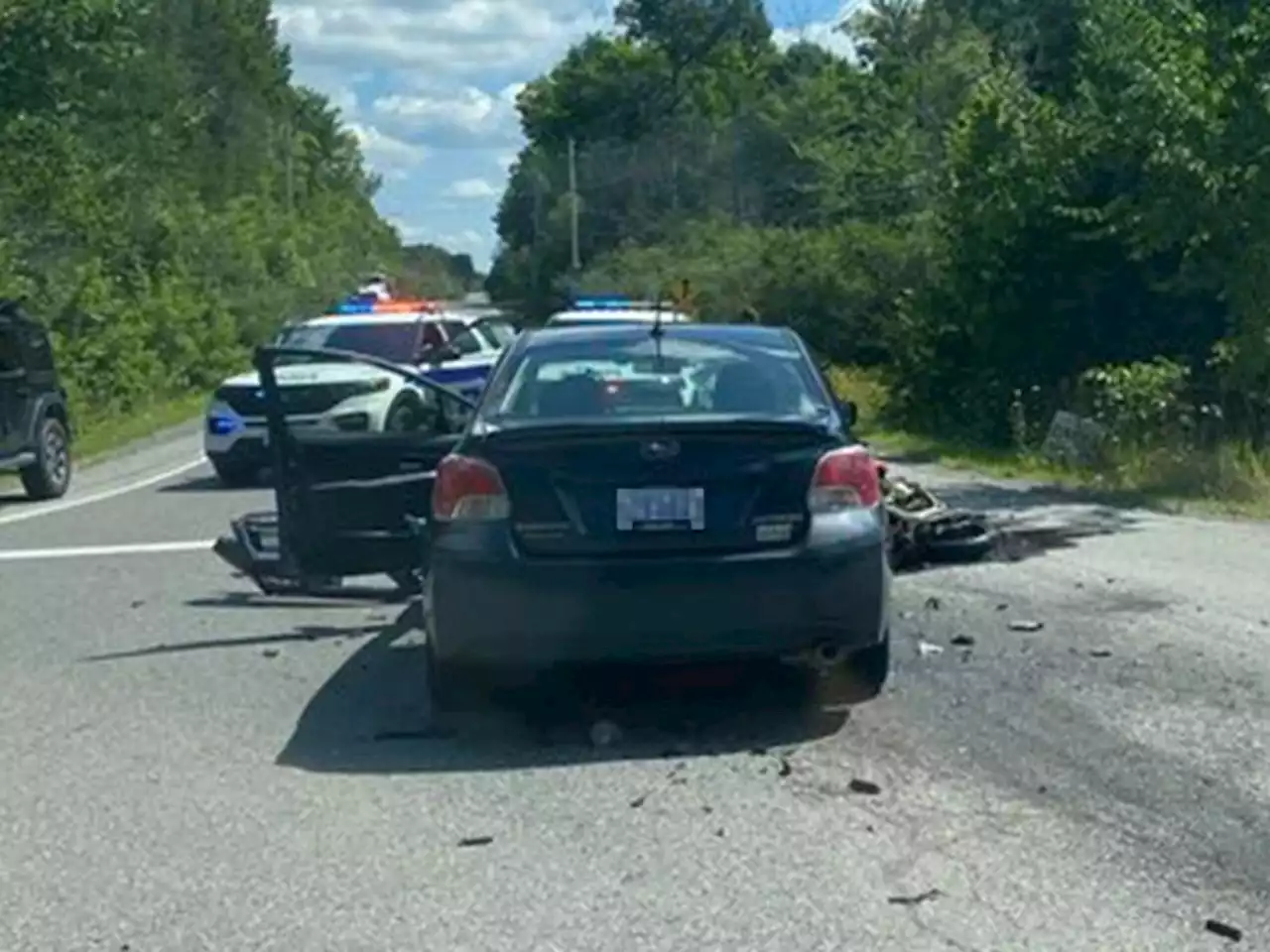 Motorcyclist collides with car, 'lucky' to survive with broken wrist and cuts