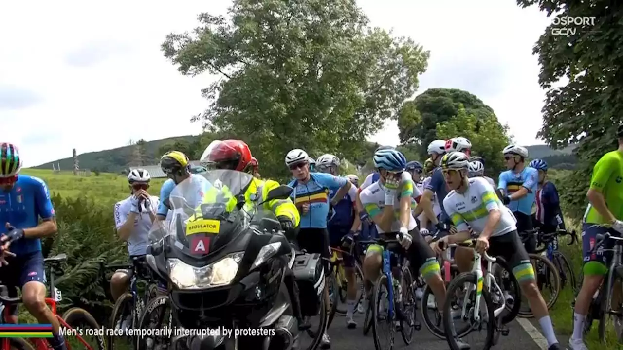 UCI Cycling World Championships road race stopped as protester reportedly “cements hand to road”